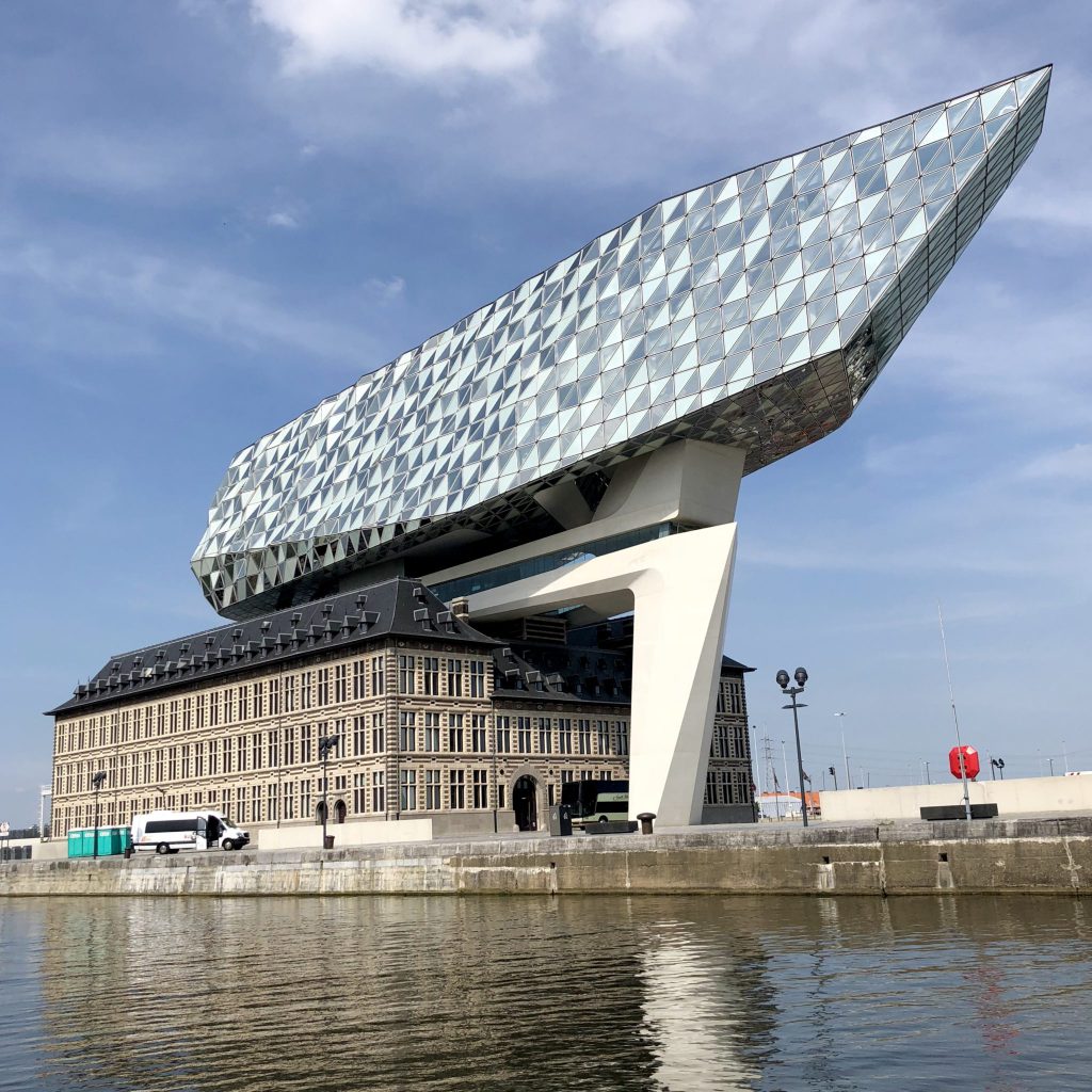 The Port House in Antwerp by Zaha Hadid restores and preserves the existing fire truck hall.