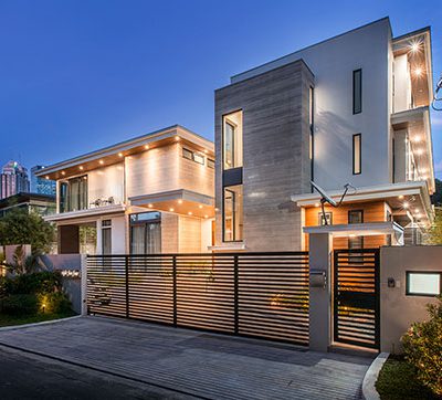 C3 Residence at night featuring nuetral colors with an elegant design facade