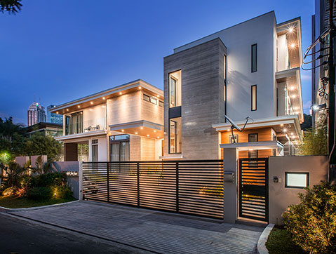 C3 Residence at night featuring nuetral colors with an elegant design facade