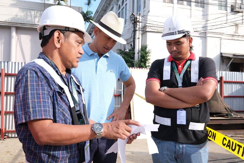 Provincial Governor Matthew J. Marcos Manotoc of Ilocos Norte looking over plans for The Staidum of the North